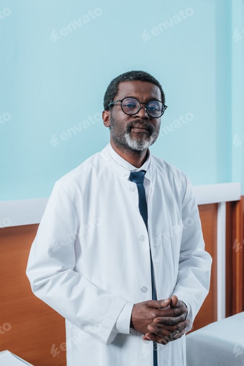 Preview: middle aged african american doctor in white coat