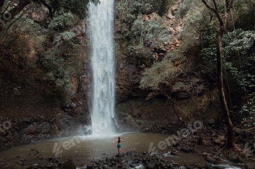 Preview: Woman enjoying waterfall, Princeville, Hawaii, US