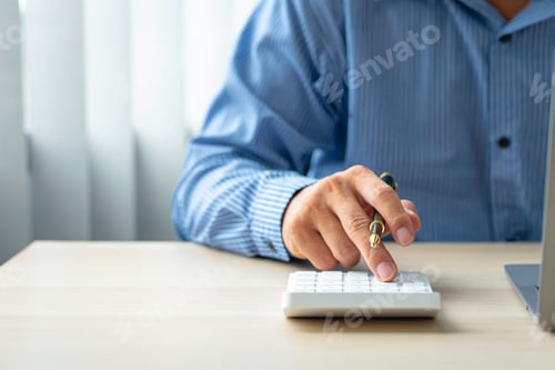 Preview: Close up account man hand using calculator for calculate and writing make a note with pen, financial