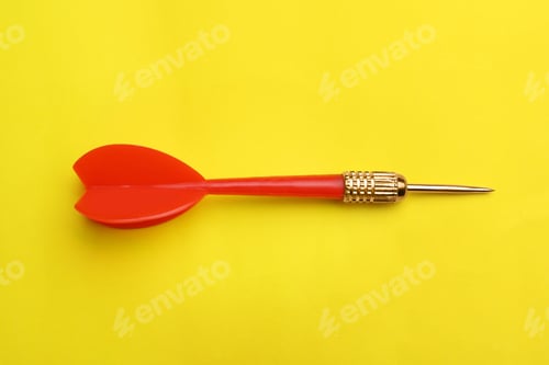 Preview: Red dart arrow on yellow background, top view
