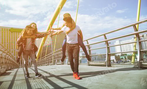 Preview: Two couples friends having fun and walking in the city
