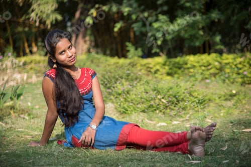 Preview: Outdoor portrait of beautiful young Indian girl in the park
