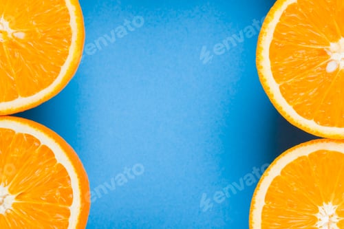 Preview: Cut Halves Of Juicy Orange On Blue Background. Orange Fruit, Citrus Minimal Concept. Creative