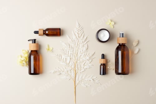 Preview: Cosmetic composition with cosmetic skin care products and flowers on pastel beige background.