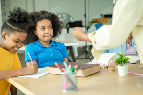 Preview: Black girl are taking test in elementary classroom school with diverse.