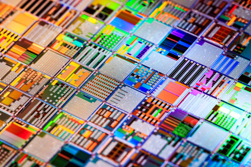 Preview: Silicon semiconductor wafer close-up.
