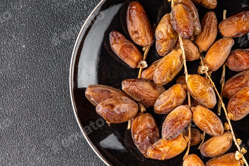 Preview: date on a branch dried sweet fruit fresh appetizer meal food snack on the table copy space food