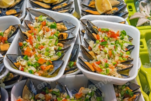 Preview: Delicious Mussels Topped with Chopped Vegetables and Lemon