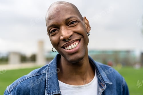 Preview: Happy African gay man celebrating pride festival - LGBTQ community concept