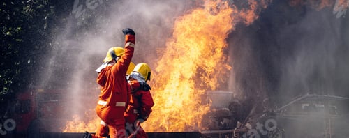 Preview: Firefighter Concept. Several firefighters go offensive for a fire attack.