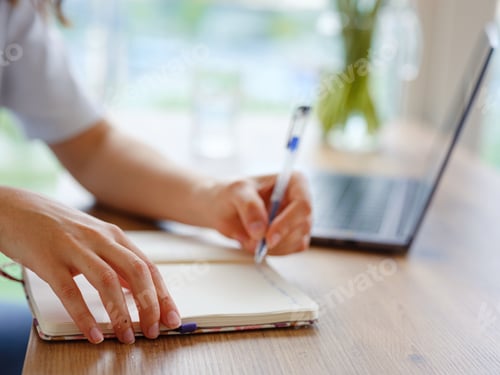Preview: woman using laptop while working indoors