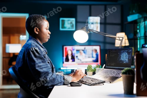 Preview: Woman using laptop for data analysis