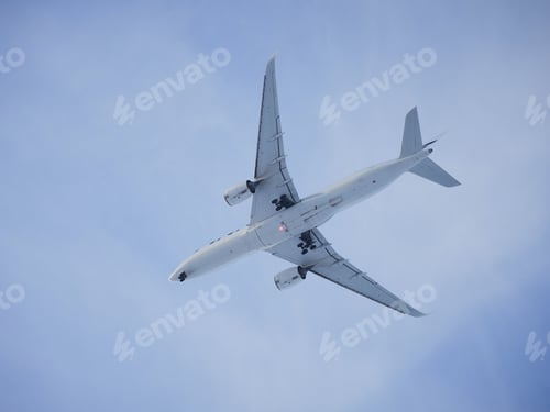 Preview: Plane in blue sky.