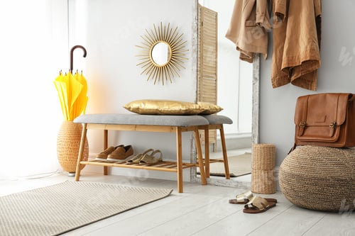 Preview: Stylish hallway interior with large mirror and storage bench near light wall