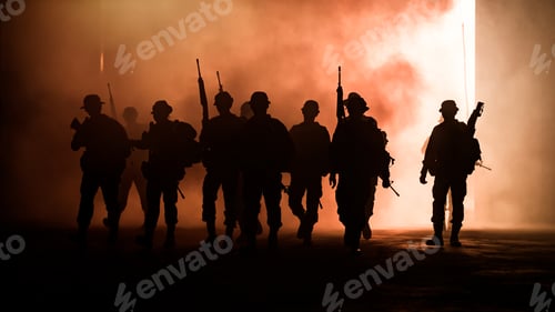 Preview: Silhouette of man with rifles as soldiers walk through the smoke