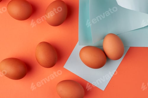Preview: Top view organic brown eggs and napkins.