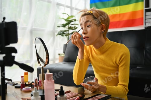 Preview: LGBTQ vlogger, influencer asian man blogger recording recording makeup tutorial.