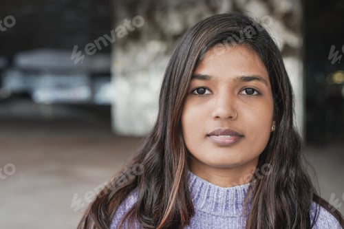 Preview: Young indian woman looking on camera