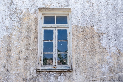 Preview: Window with blue open shutter on white wall. Cyclades island house, Greek traditional architecture.