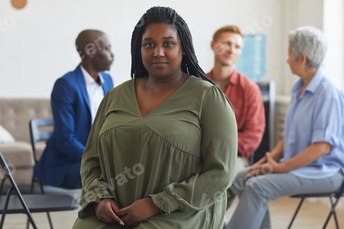 Preview: Woman Attending Group Therapy Session with Others