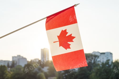 Preview: Flag of Canada from window, on sunset background