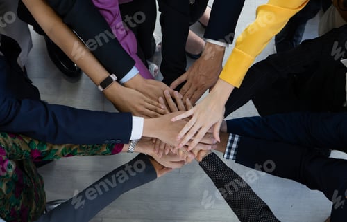 Preview: Team, teamwork, and unity concept. Diverse team putting hands together. Group of diverse busines