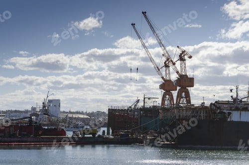 Preview: View of cranes in a seaport at the daylight