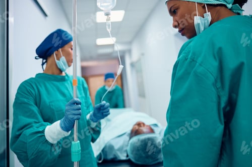 Preview: Female doctors taking the patient out of the operating room in the hospital.