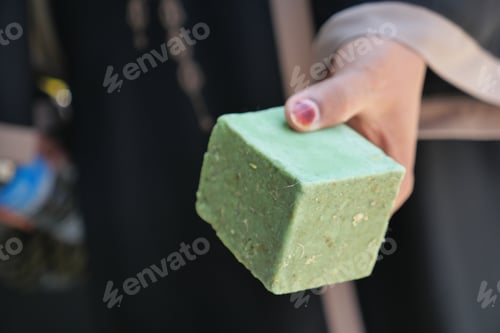 Preview: Traditional green soap block displayed at local market