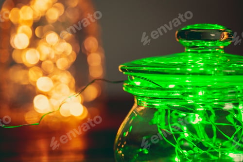 Preview: Green garland with light bulbs put in glass storage jar