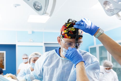 Preview: Surgeon and the nurse are preparing for surgery in the operating room. Put on gowns, hats and masks