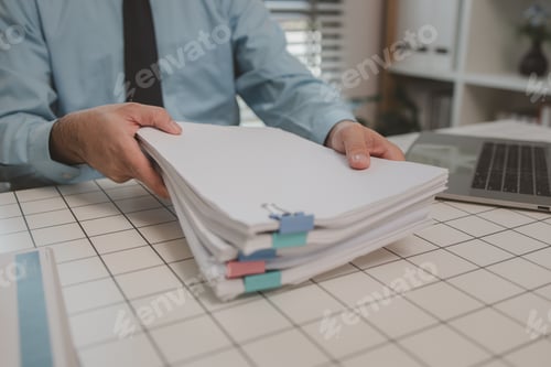 Preview: a businessman is handling documents in the office, an accountant is collecting documents