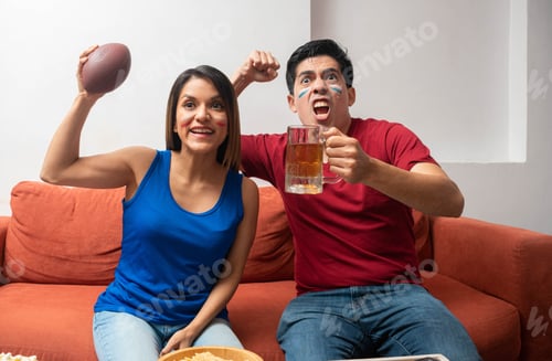 Preview: Enthusiastic Fans Celebrate with Football and Beer