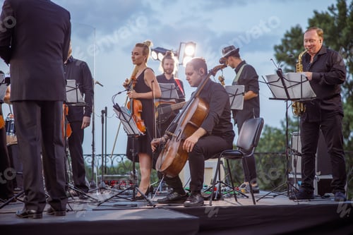 Preview: Musical ensemble having concert rehearsal on the street