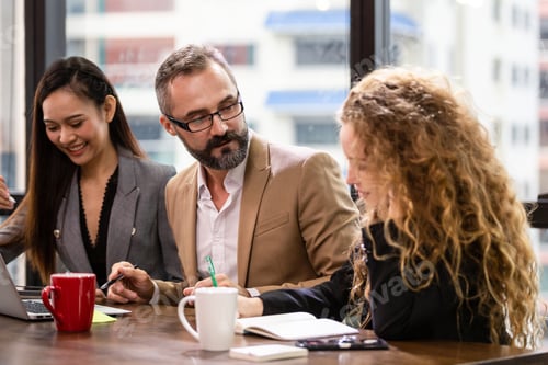Preview: Group of businesspeople having a meeting in the office