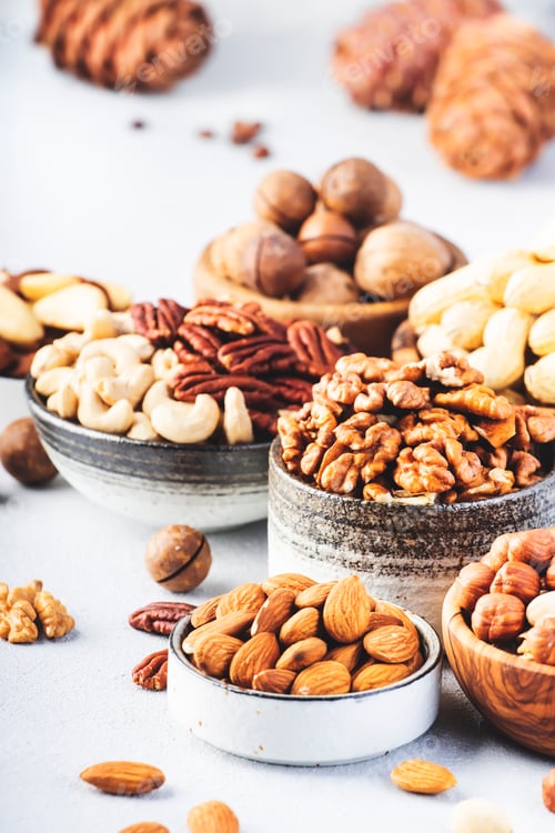 Preview: Assortment of nuts in bowls. Cashews, hazelnuts, walnuts, pistachios, pecans