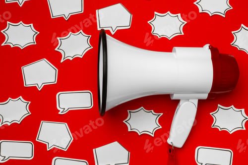 Preview: Electronic megaphone with speech bubble on red background