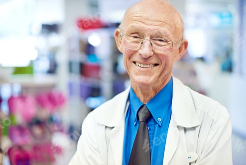 Preview: Years of medicinal experience. Portait of a senior pharmacist at work.