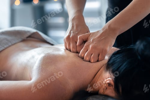 Preview: Fist massage for shoulders and neck in spa. Trapezius relief