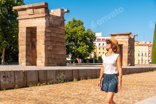 Preview: Temple of Debod in Madrid city of Egypt, tourist woman with hat in ancient Egyptian temple