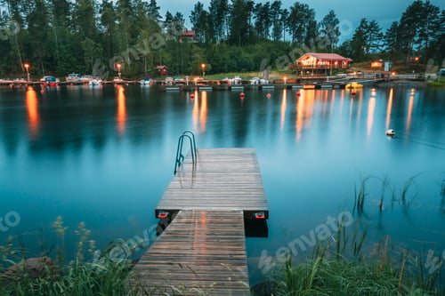 Preview: Sweden. Beautiful Wooden Pier Near Lake In Summer Evening Night.