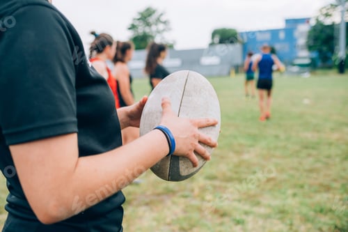 Preview: Ready to play A person holding a rugby ball on the field
