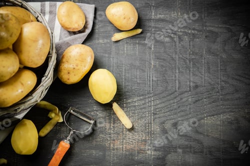 Preview: Fresh potatoes. On black background.