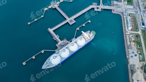 Preview: LNG (Liquified Natural Gas) tanker anchored in Gas terminal gas tanks for storage. Oil Crude Gas