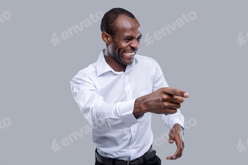 Preview: Good Mood. Attractive Delighted Dark-Eyed Afro-American Man Wearing A White Shirt And Laughing And
