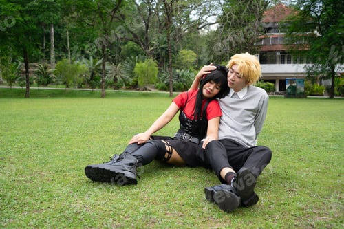 Preview: Cosplayers relaxing on grass in a park