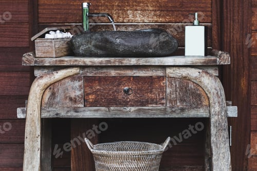 Preview: Wooden table with a stone sink and toiletries