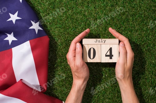 Preview: Man Holding Calendar With 4th July Date With American Flag