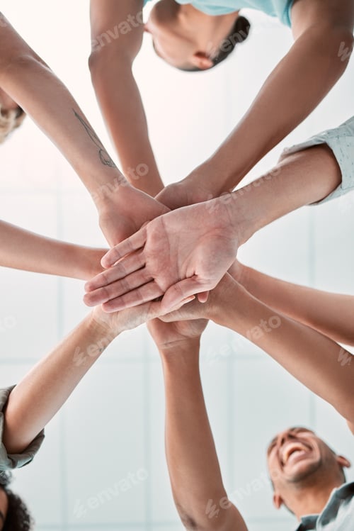 Preview: Hands, collaboration and unity with a business team in a huddle or circle in the office together fr