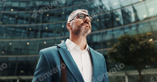 Preview: Banker, thinking or businessman in city with building, ambition or financial opportunity. Travel, f